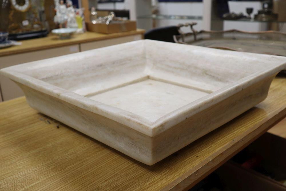 A square marble dish, 51cm sq.